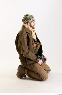 Andrew Elliott Insurgent Kneeling holding gun kneeling whole body 0006.jpg